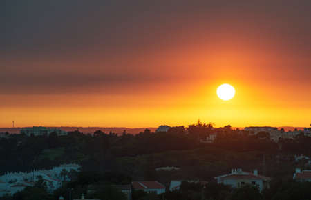 Beautiful sunset over the city of Portimao, Portugal.の写真素材