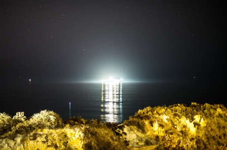 Expensive yacht in the sea at night.の写真素材