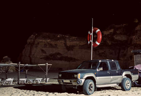 Rescuers car on the beach at night.の写真素材