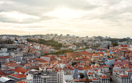 View of old city and modern city of Lisbon at sunset.の写真素材