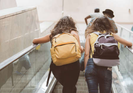 Passengers using electric escalator in metro.の写真素材