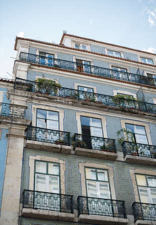 Facade of old apartment building with balconies.の写真素材
