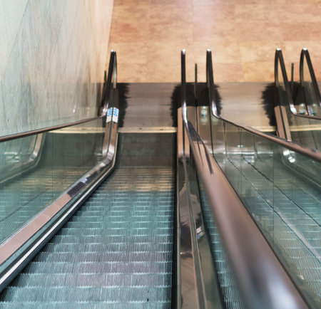 Electric escalator in metro. Moving staircase.