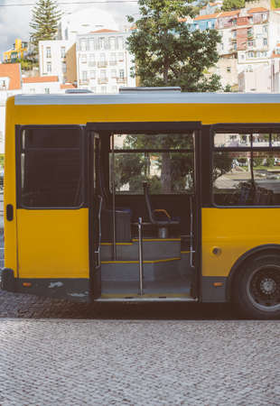 Bus waiting for passengers at the bus stop.の写真素材