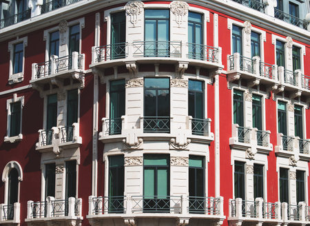 Facade of old apartment building with balconies.