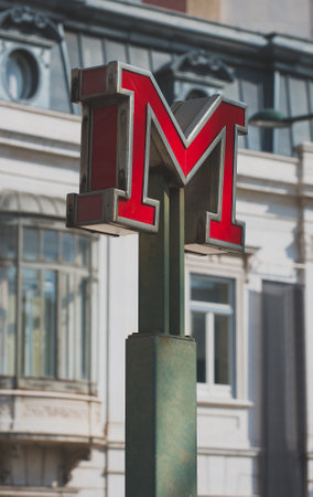 Red metro sign in the city.のeditorial素材