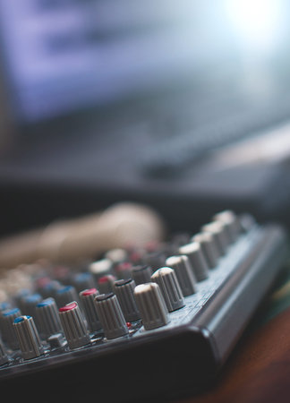 Mixer, condenser microphone and midi keyboard. Concept of home music studio.