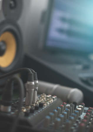 Mixer, condenser microphone and professional monitor. Concept of home music studio.の写真素材