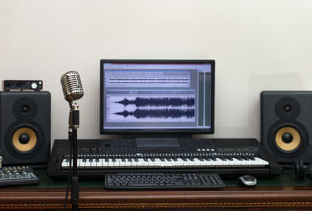 Home recording studio with professional monitors and midi keyboard.の写真素材