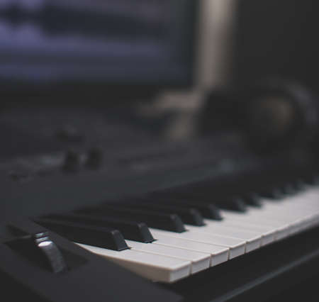 Midi keyboard and pc with music software. Concept of home music studio.の写真素材