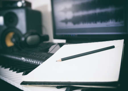 Piano keyboard, pen and sheet. Concept of composing song.の写真素材