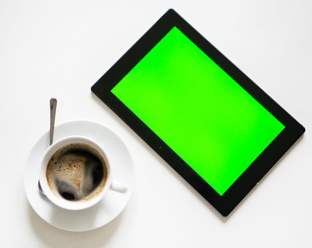 Black tablet pc with green screen. Chroma key.