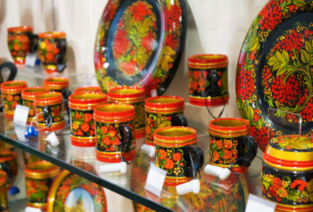Khokhloma painting on tableware in the shop.の写真素材