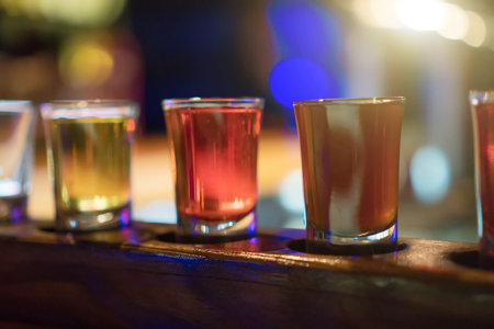 Shot glasses with liquor in the bar.