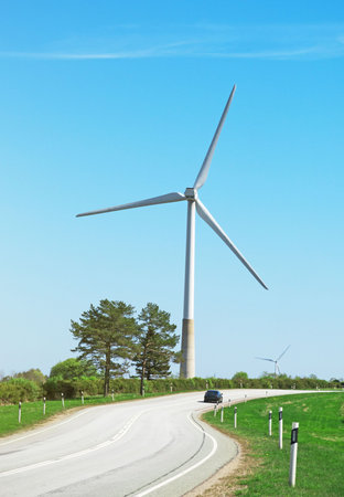 Wind turbine near the road. Eco-energy concept.
