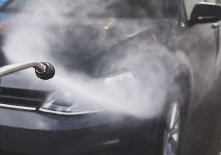Car wash using high pressure water jet.の写真素材