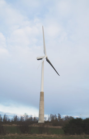 View of Wind turbine over blue sky.