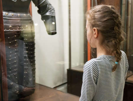 Little girl exploring expositions in museum.の写真素材