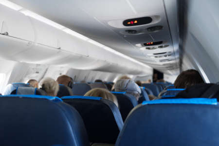 Interior inside of the plane with passengers.の写真素材