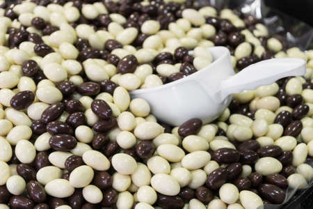 Brown and white chocolate balls in the shop.の写真素材