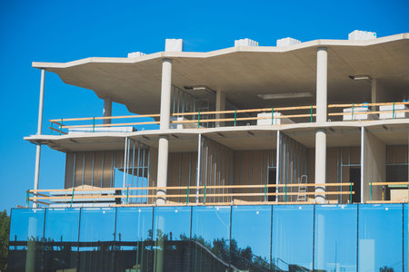 Facade of new modern apartment building. Under construction.