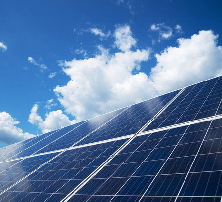 Blue solar panels over blue sky. Renewable energy.