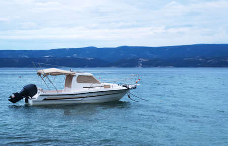 Rescue motor boat at sea during a beginning storm.の写真素材