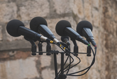 Microphones prepared for press conference on the street.