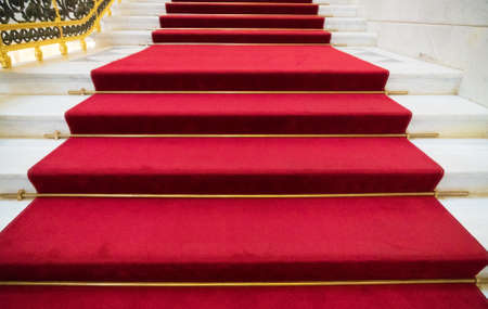 Staircase and red carpet in the palace.の写真素材