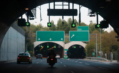 Cars driving through the tunnels.