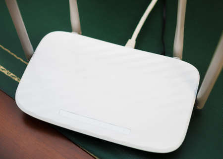 White wireless router standing on the table.の写真素材