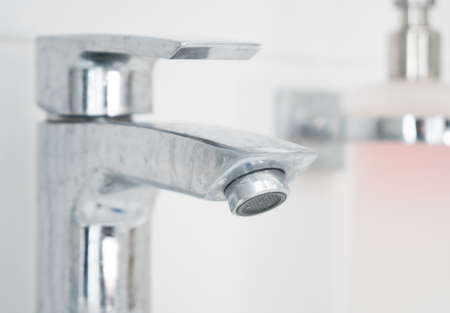 Dirty water tap in bathroom.の写真素材
