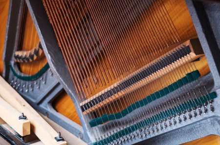 Close-up view of strings inside the piano.の写真素材
