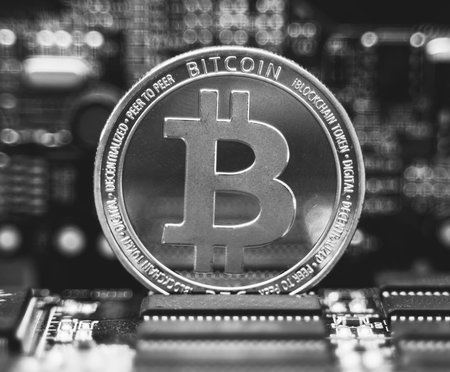 Silver bitcoin and video card. Cryptocurrency mining concept.