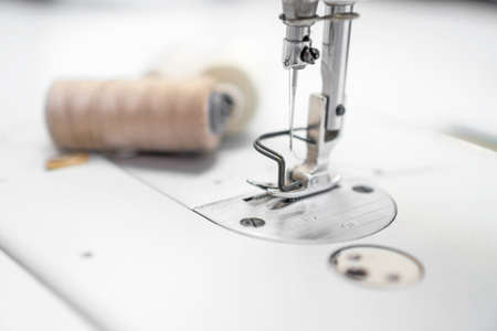 Sewing concept. Sewing machine and spool threads.の写真素材