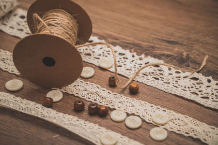 Sewing concept. Ribbons, buttons and thread spool.の写真素材