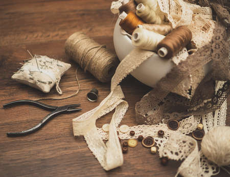 Sewing concept. Thread spools, buttons and sewing needles.の写真素材