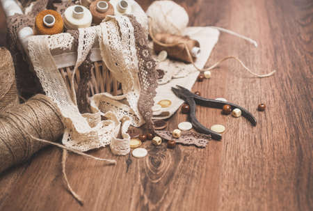 Sewing concept. Thread spools, buttons and sewing needles.の写真素材