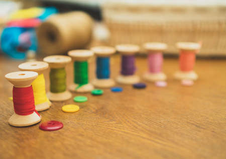 Sewing concept. Colorful buttons and thread spools.の写真素材