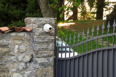 Metal gates and security camera. Private property.