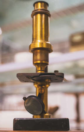 Retro golden microscope in the laboratory.の写真素材