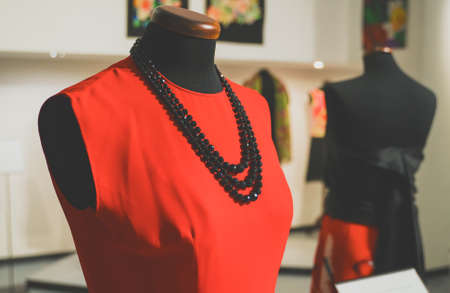 Collection of new dresses on mannequins in showroom.の写真素材