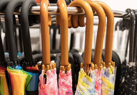 Many umbrellas for sale in the store.