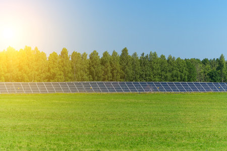 Blue solar panels in the field. Renewable energy.