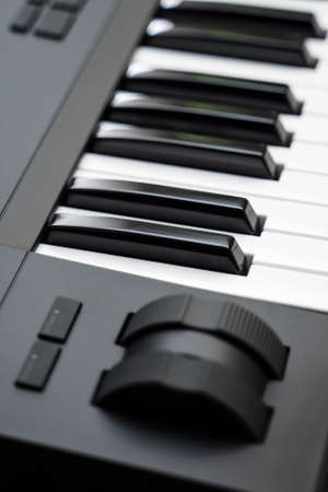 Professional midi keyboard synthesizer with knobs and controllers. Modulation and pitch wheels.の写真素材