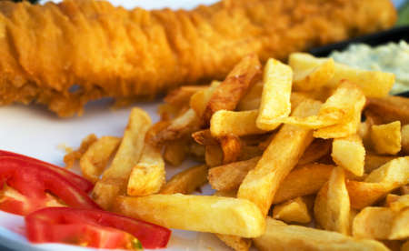 Street food. Breaded cod fillet with french fries.の写真素材
