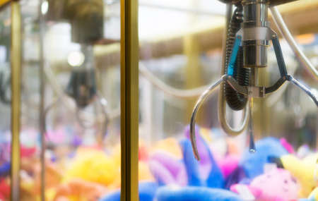 Mechanical claw game machine. Close-up view.の写真素材