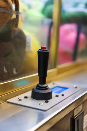 Mechanical claw game machine. Close-up view.