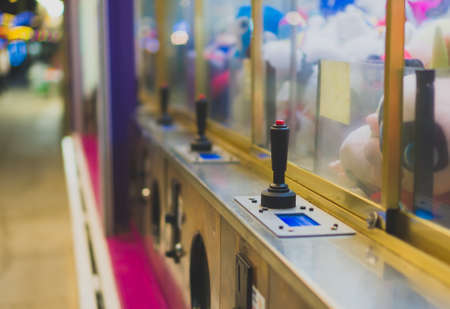 Mechanical claw game machine. Close-up view.の写真素材