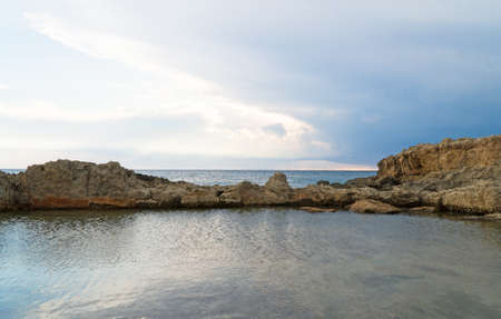 Beautiful lava stones on the Cyprus seashore.の写真素材